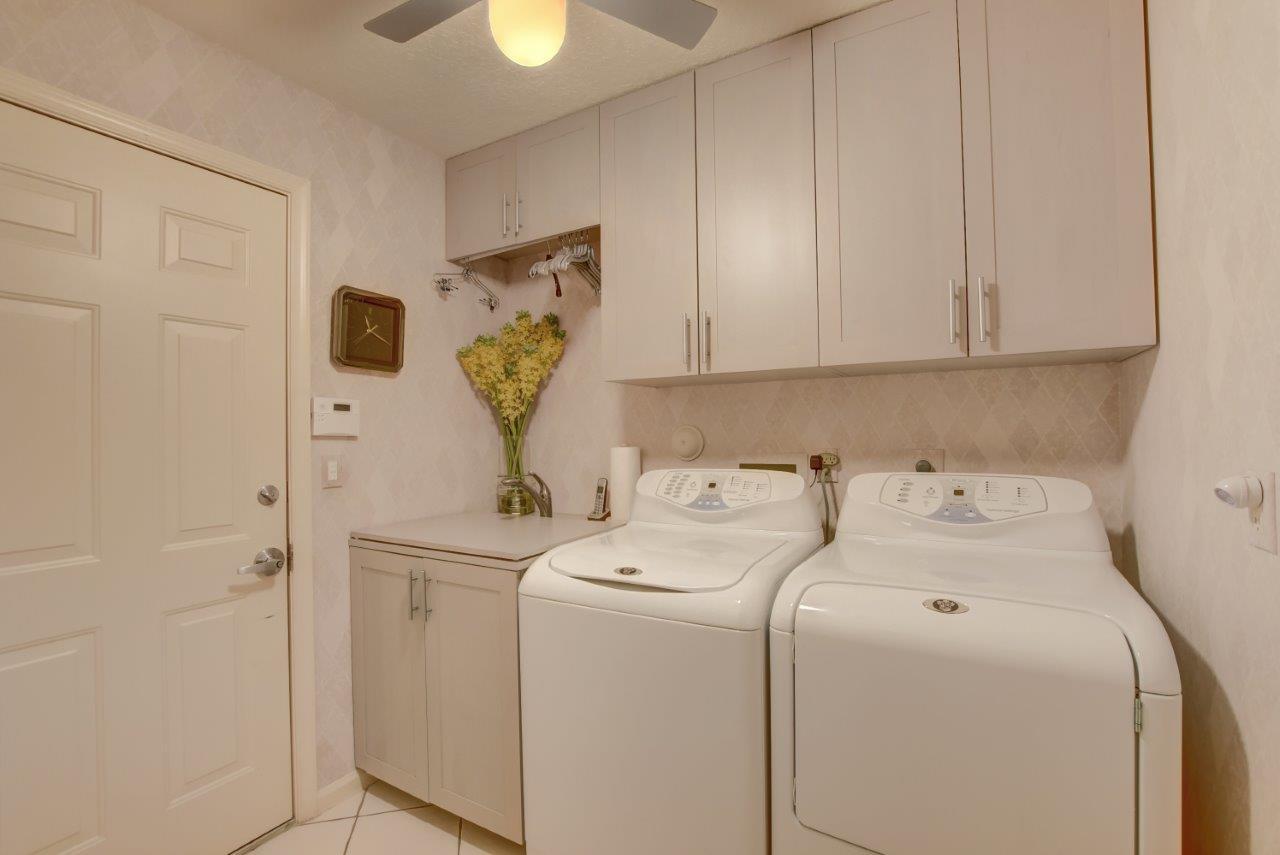 5758 Northwest 24th Terrace Boca Raton, FL 33496 - Photo 29 of 35 a utility room with dryer and washer