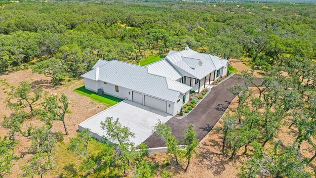 an aerial view of a house with a garden