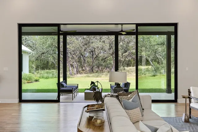 a living room with furniture and a large window