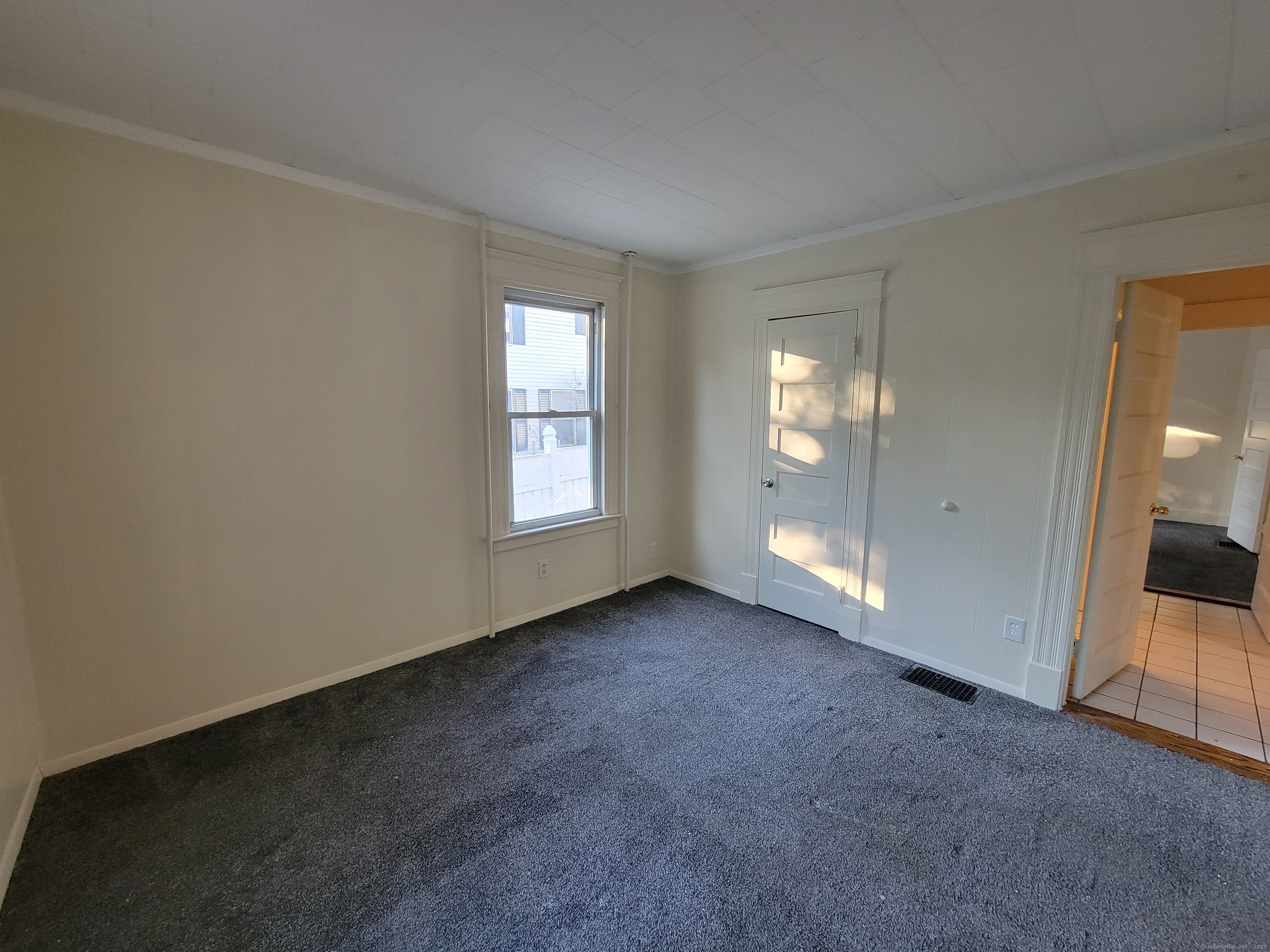 138 Federal Street Bristol, CT 06010 - Photo 16 of 17 an empty room with windows and entrance