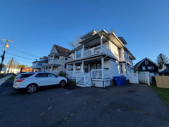 a car parked in front of a house
