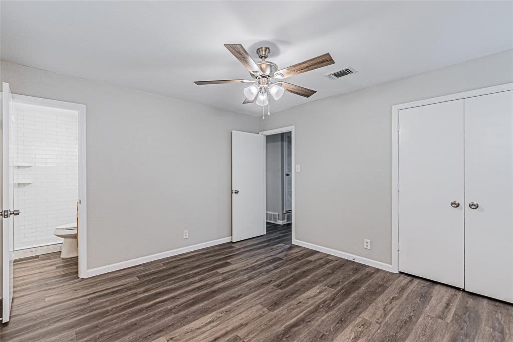 1205 Navaho Street Arlington, TX 76012 - Photo 9 of 18 a view of an empty room and wooden floor