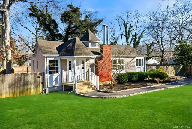 a view of a house with backyard porch and sitting area