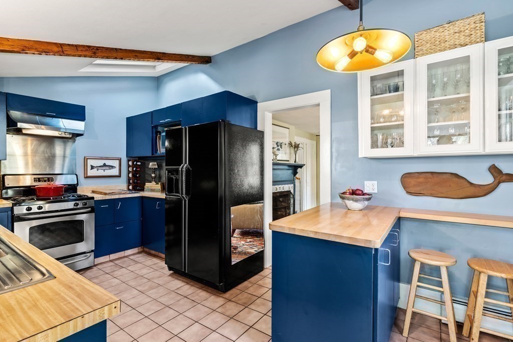 7 Circle Street Marblehead, MA 01945 - Photo 13 of 36 a kitchen with stainless steel appliances granite countertop a refrigerator and a stove top oven