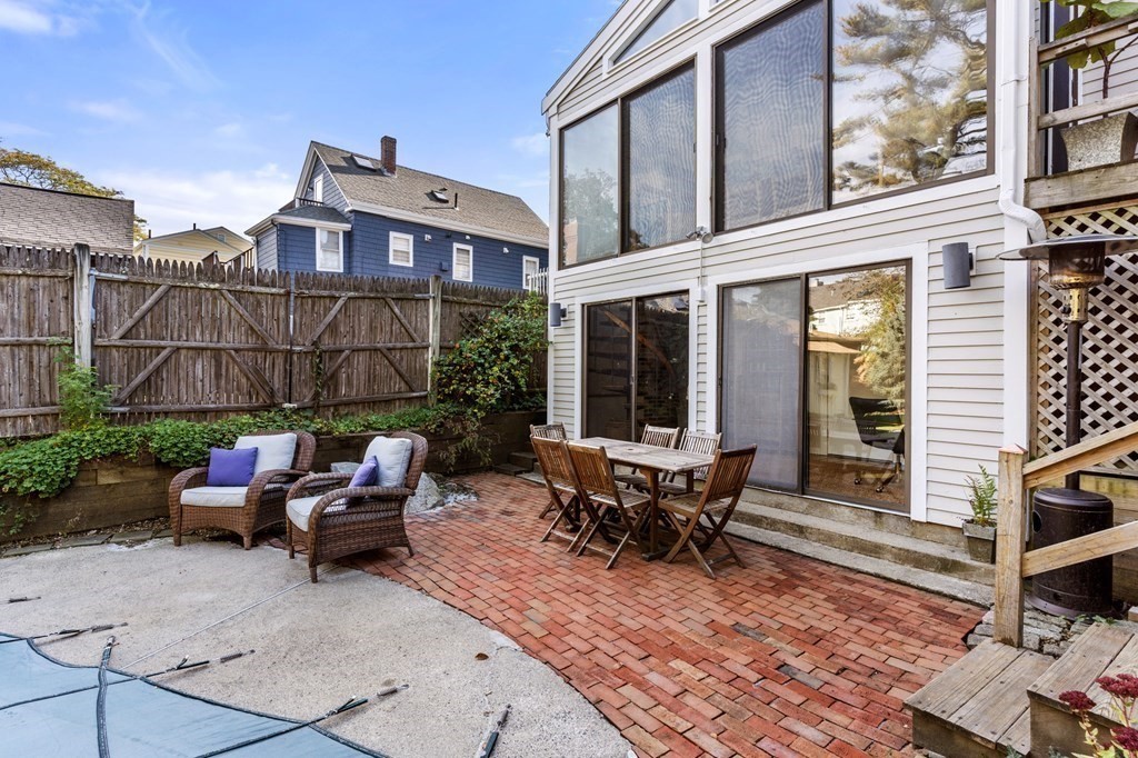7 Circle Street Marblehead, MA 01945 - Photo 28 of 36 a view of a patio with couple of chairs in front of building