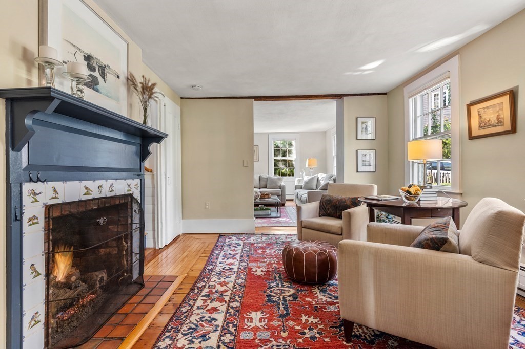 7 Circle Street Marblehead, MA 01945 - Photo 8 of 36 a living room with furniture and a fireplace
