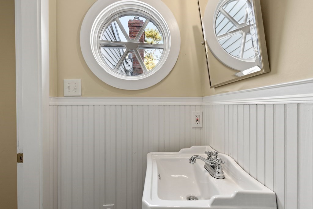 7 Circle Street Marblehead, MA 01945 - Photo 9 of 36 a bathroom with a sink and a mirror