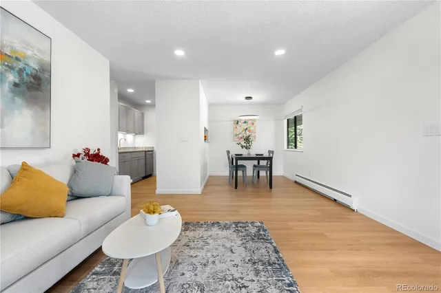 a living room with furniture and a table