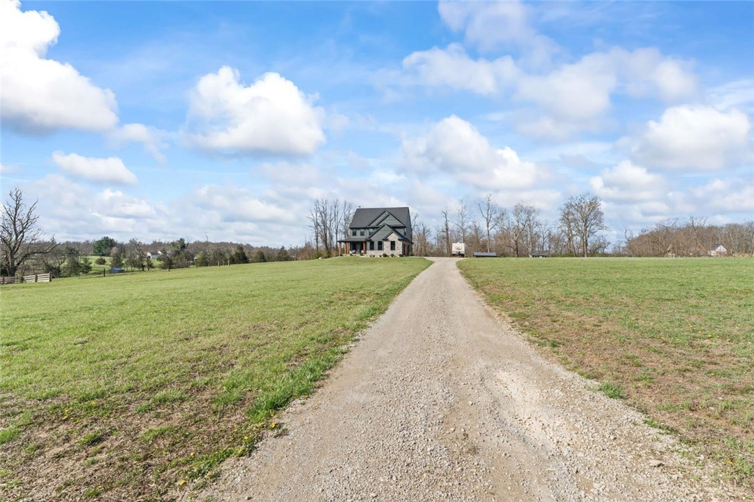 2425 Middleboro Road Clarksville, OH 45113 - Photo 2 of 91 This charming residence is nestled within expansive, verdant grounds, offering a private and picturesque setting.