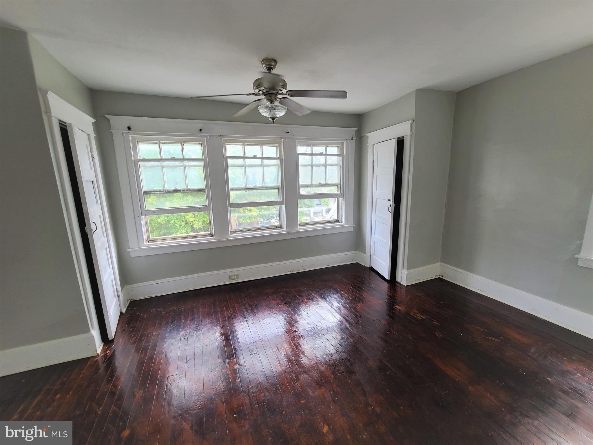 1008 McDowell Avenue Chester, PA 19013 - Photo 12 of 16 a view of an empty room with wooden floor and a window