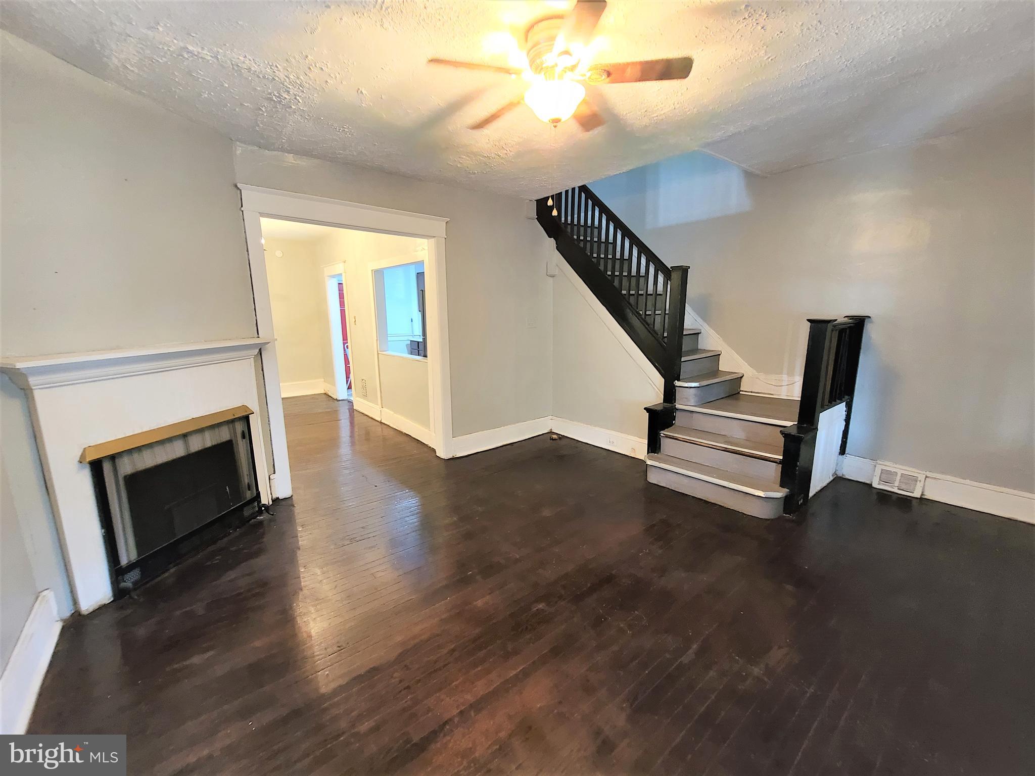 1008 McDowell Avenue Chester, PA 19013 - Photo 6 of 16 a view of livingroom with furniture wooden floor and front door