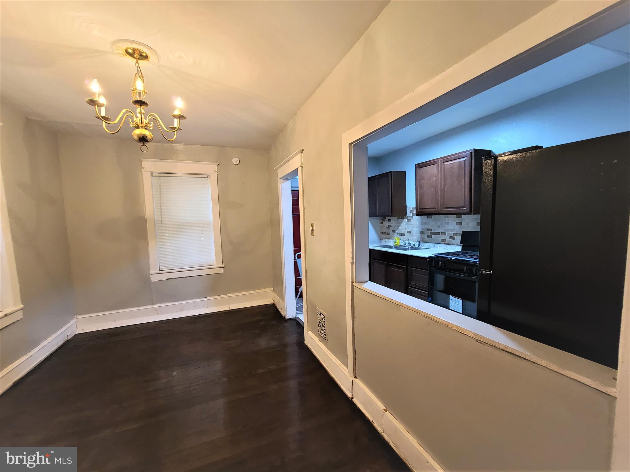1008 McDowell Avenue Chester, PA 19013 - Photo 9 of 16 a kitchen with stainless steel appliances a refrigerator sink and microwave