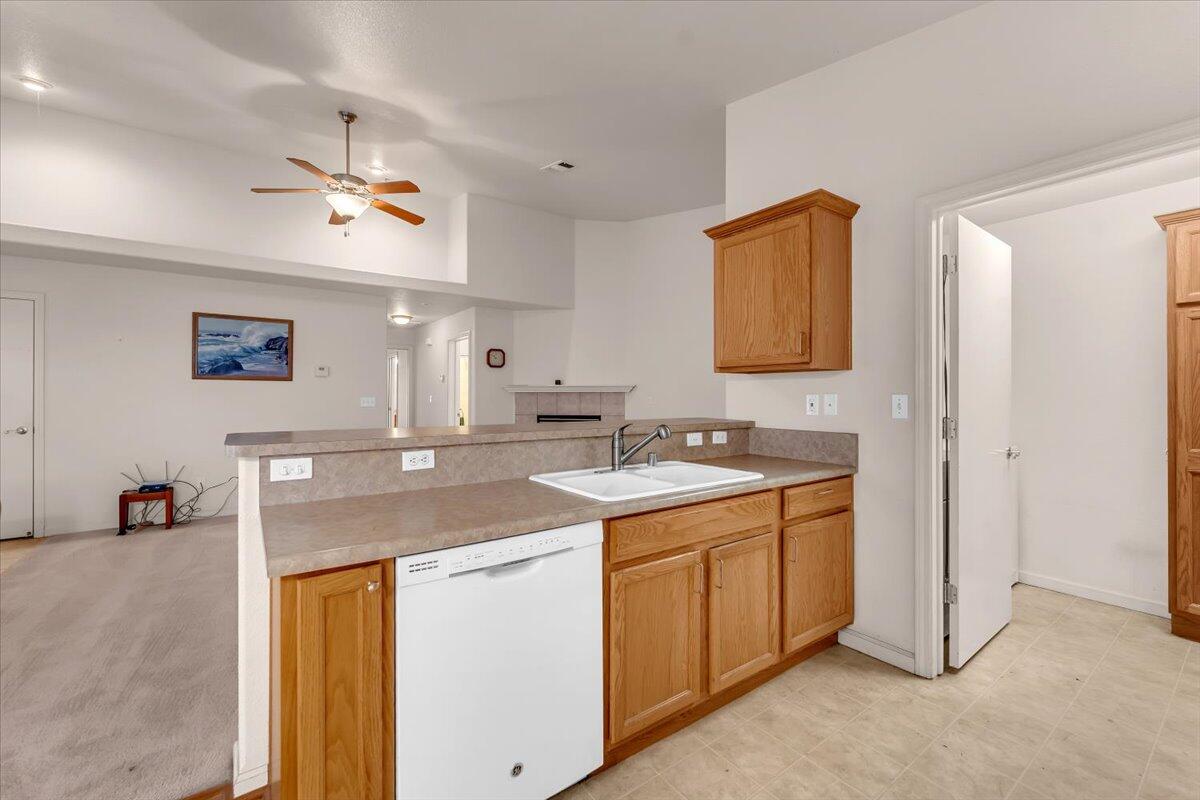 738 Stonebriar Trail Redding, CA 96003 - Photo 13 of 40 a kitchen with a sink and cabinets