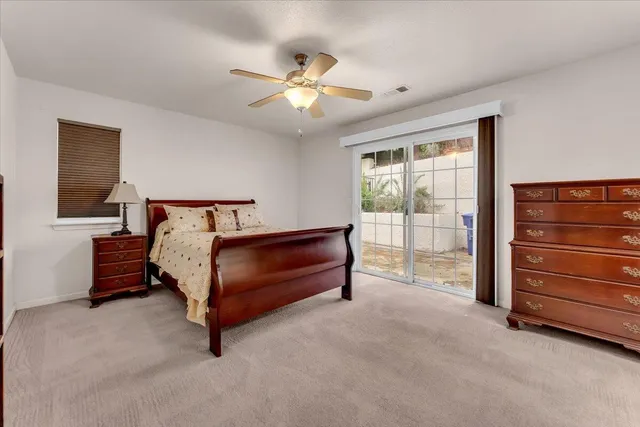 a bedroom with a bed and a cabinets