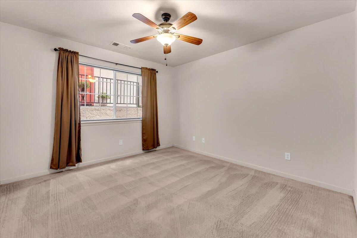 738 Stonebriar Trail Redding, CA 96003 - Photo 20 of 40 a view of an empty room with a window