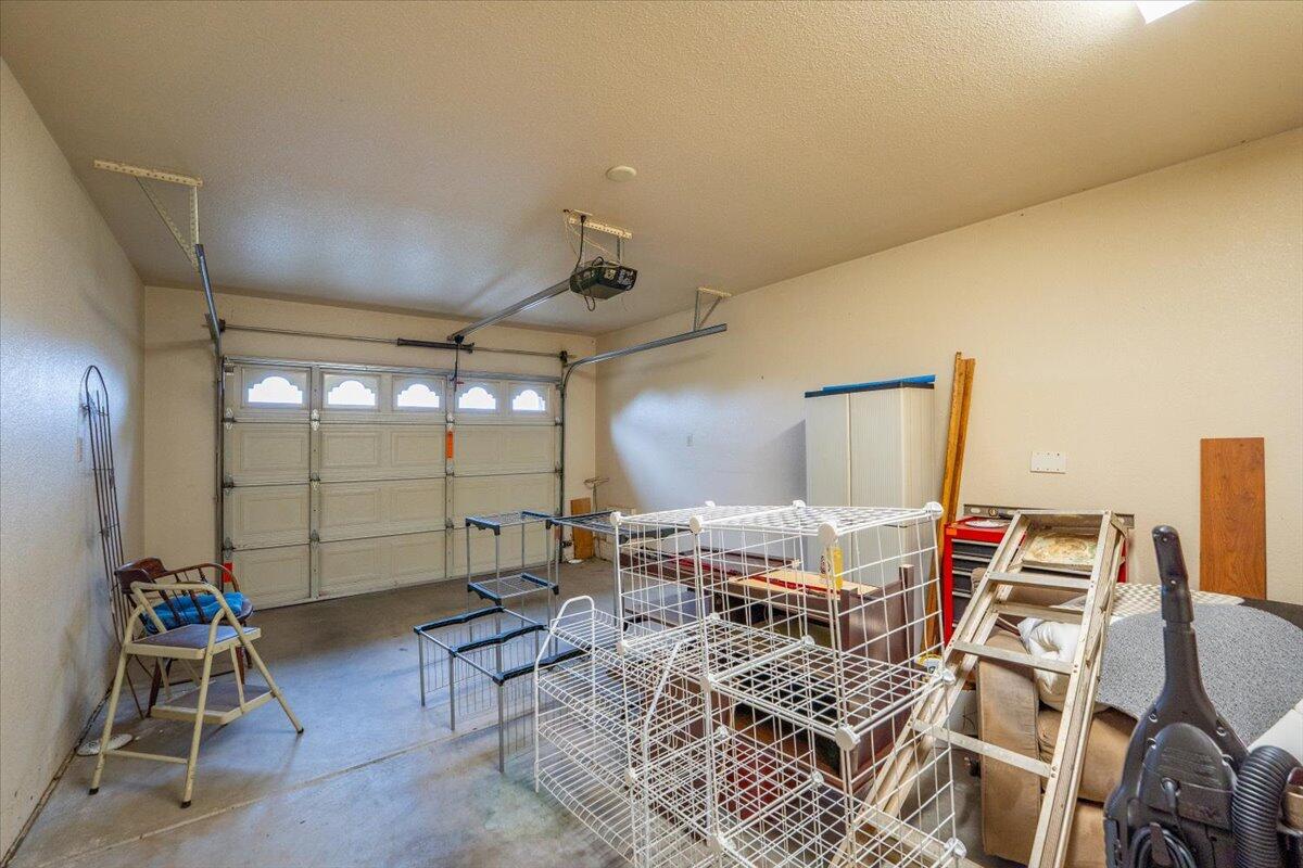 738 Stonebriar Trail Redding, CA 96003 - Photo 25 of 40 a living room with a couch and a table