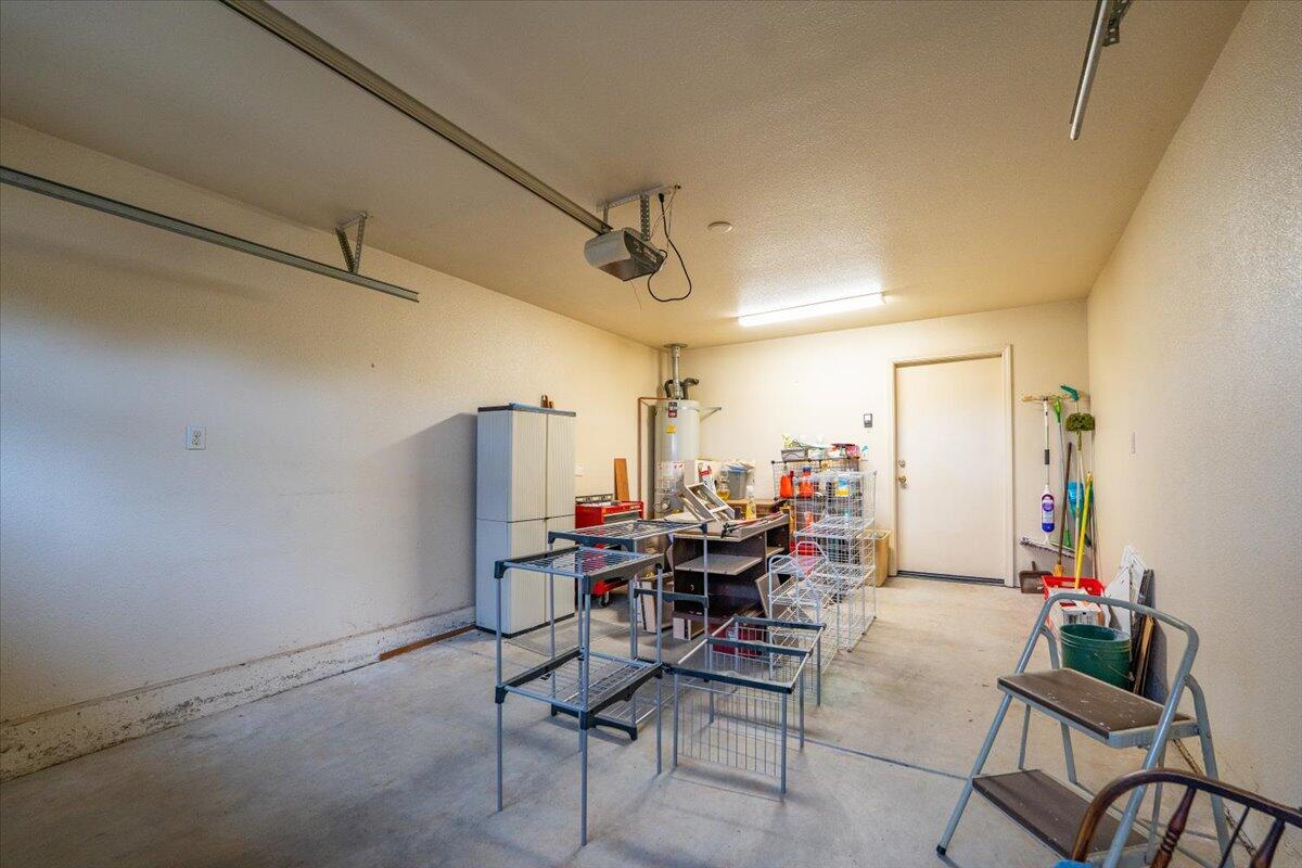 738 Stonebriar Trail Redding, CA 96003 - Photo 26 of 40 a view of a dining room with furniture and a rug