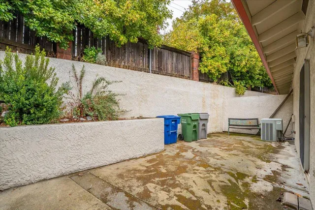 a view of a house with a backyard and stairs