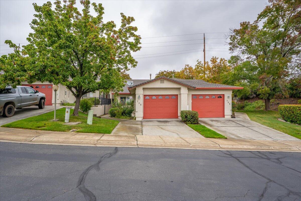 738 Stonebriar Trail Redding, CA 96003 - Photo 32 of 40 a house with a yard and a outdoor space