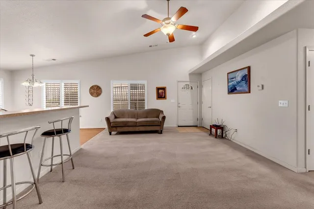 a living room with furniture and white walls