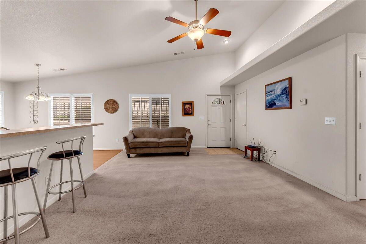738 Stonebriar Trail Redding, CA 96003 - Photo 9 of 40 a living room with furniture and white walls