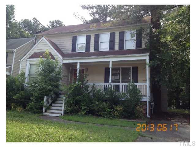 7204 Ewing Place Raleigh, NC 27616 - Photo 1 of 7 a front view of a house with a yard