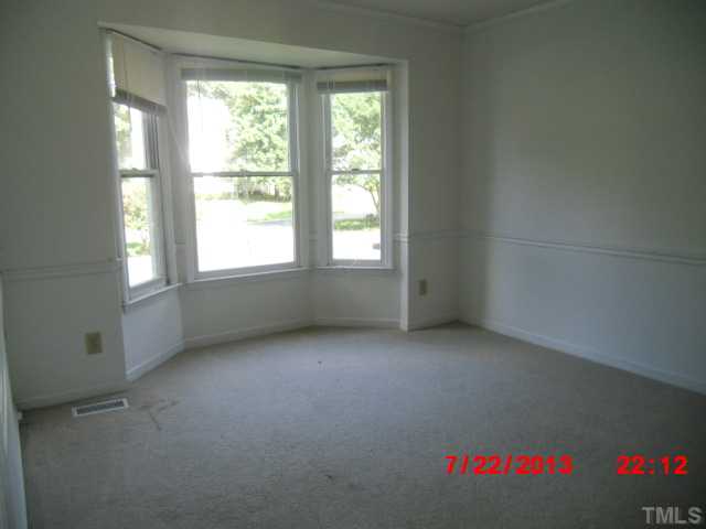 7204 Ewing Place Raleigh, NC 27616 - Photo 4 of 7 an empty room with a window