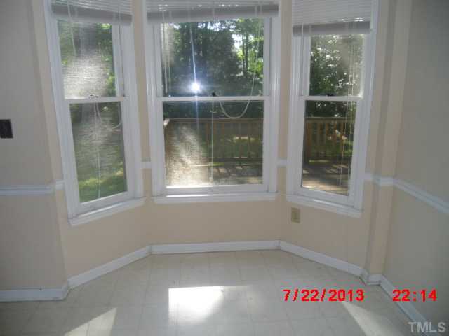 7204 Ewing Place Raleigh, NC 27616 - Photo 6 of 7 an empty room with windows