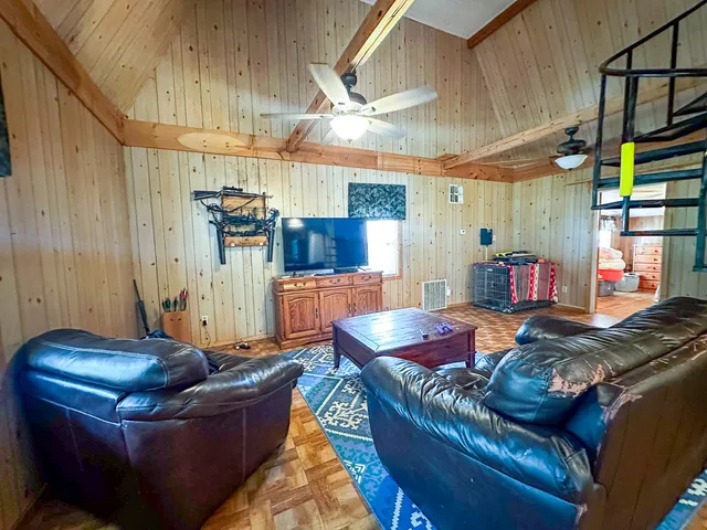 a living room with furniture and a window