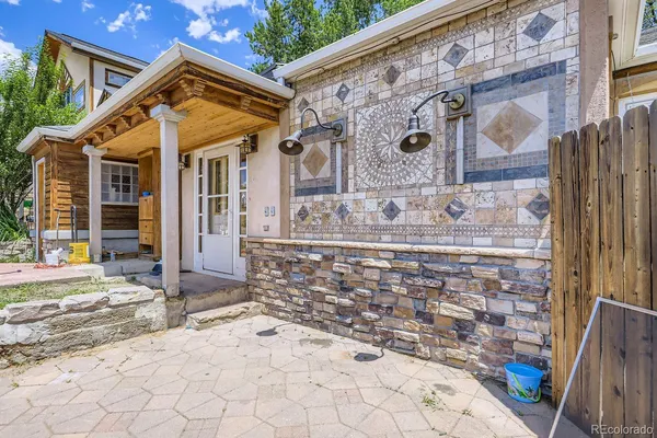 a view of brick house with large windows