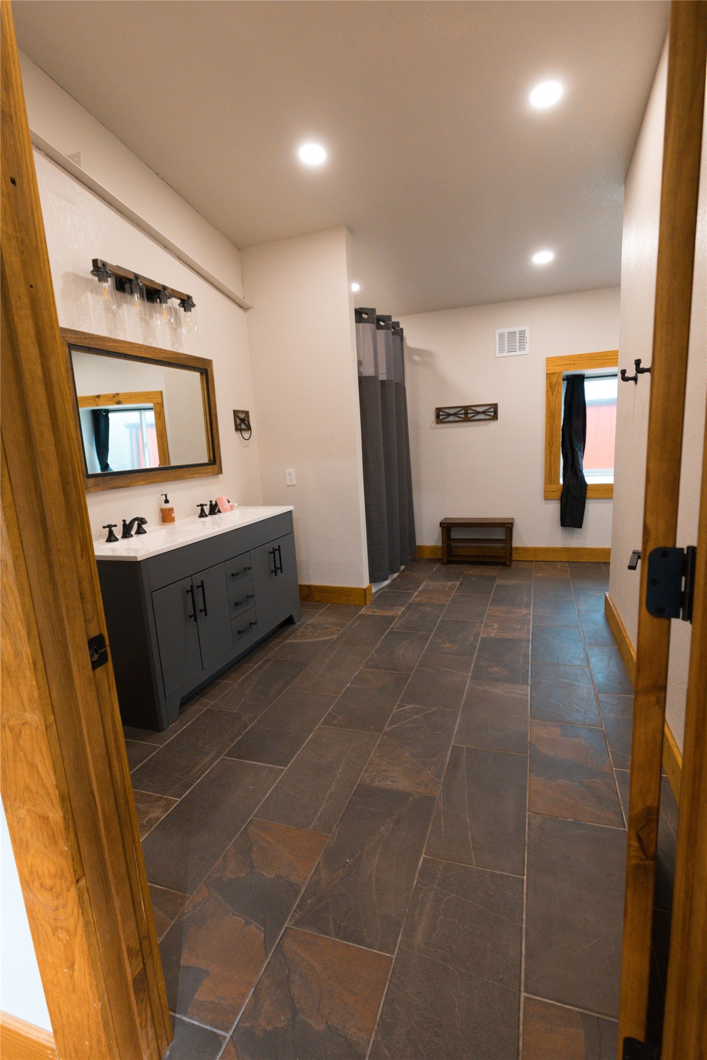 143 County Road Paige, TX 78659 - Photo 12 of 36 Upstairs Full bath with vanity, recessed lighting, and a shower with shower curtain