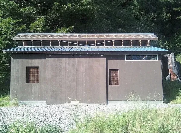 a front view of residential houses with yard