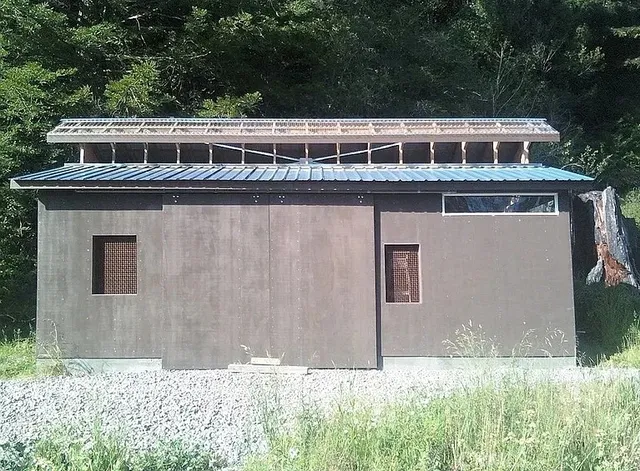 a front view of residential houses with yard