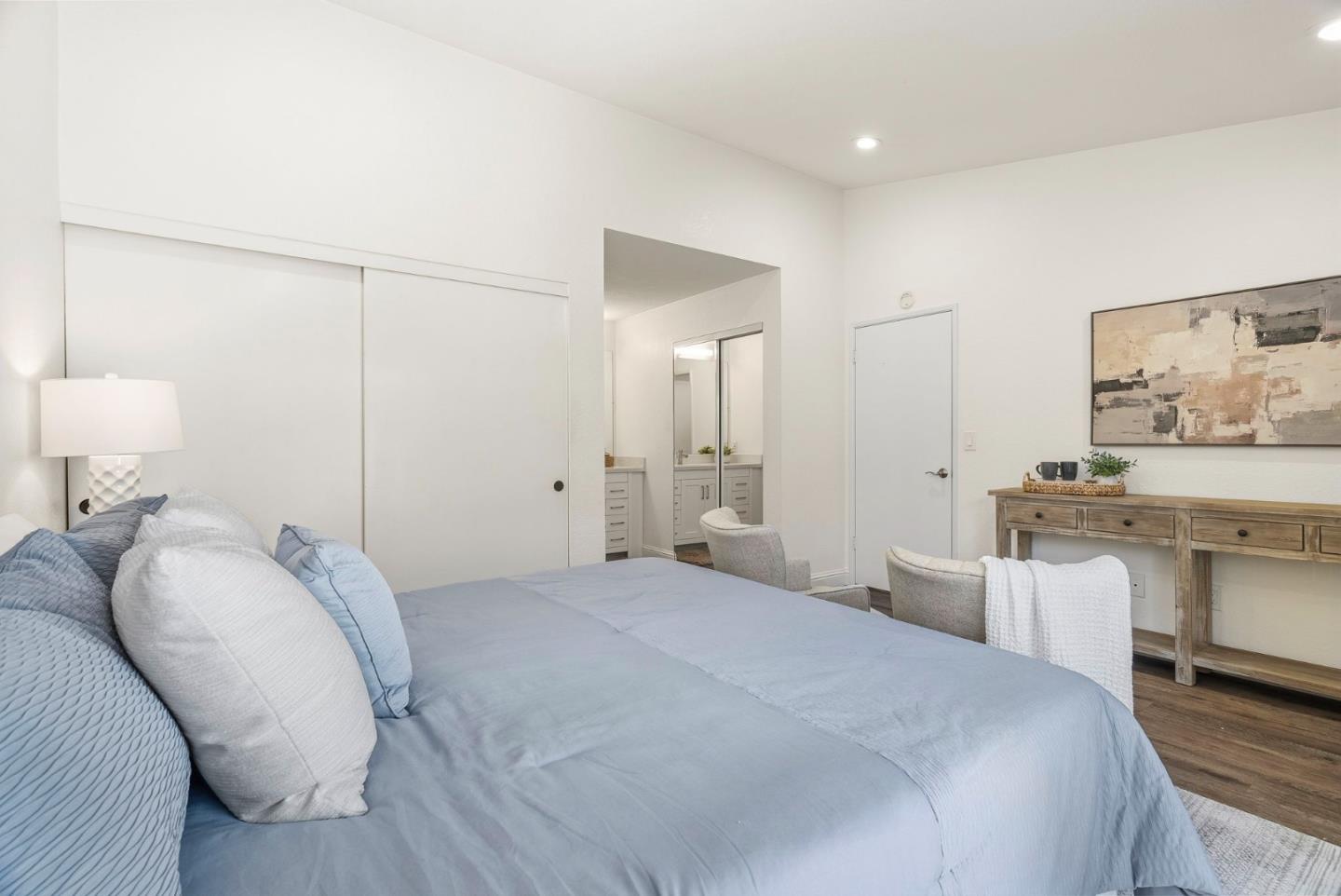 297 Perch Way Aptos, CA 95003 - Photo 24 of 42 a bedroom with a bed and a chandelier