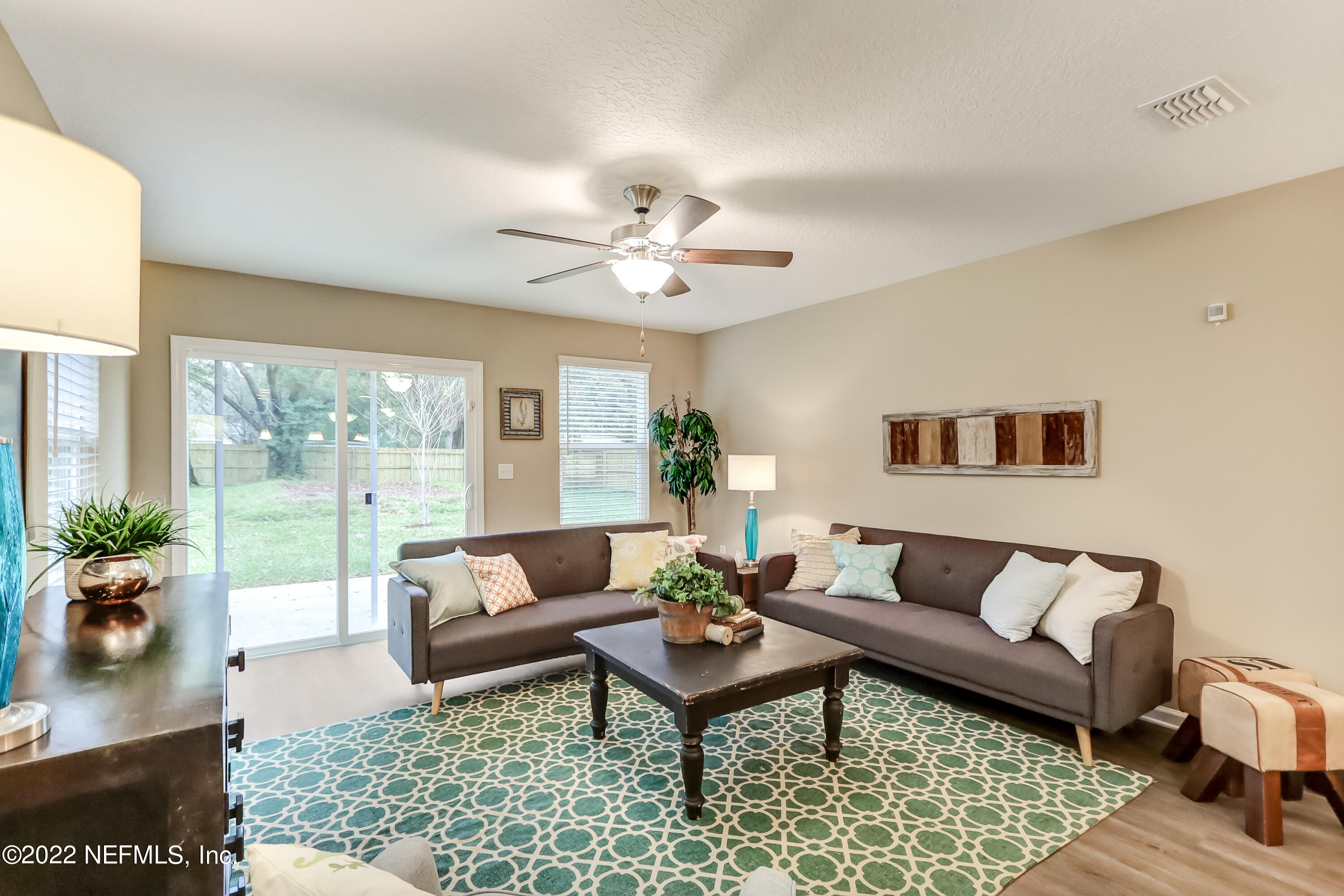 2209 Kistlers Rdg Way Jacksonville, FL 32221 - Photo 17 of 22 a living room with furniture and a rug