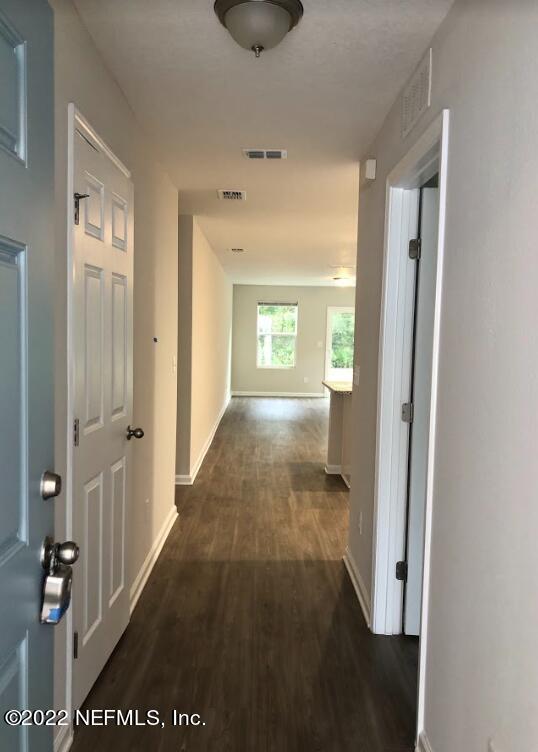2209 Kistlers Rdg Way Jacksonville, FL 32221 - Photo 3 of 22 a view of hallway with bathroom and a window