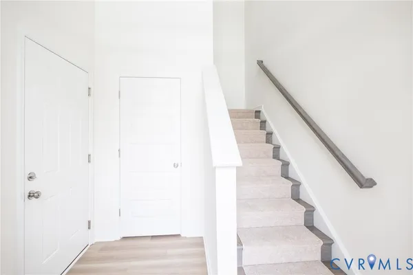 a view of staircase with white walls and white walls