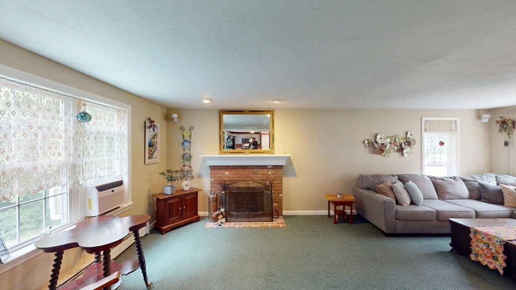 11 Valley View Circle Rutland, MA 01543 - Photo 16 of 38 a living room with furniture and a fireplace