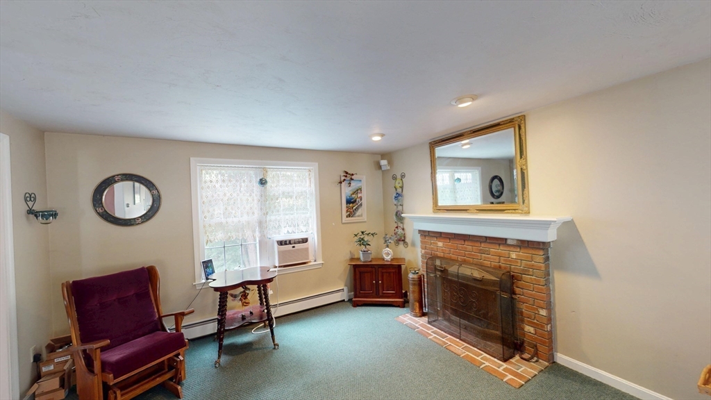 11 Valley View Circle Rutland, MA 01543 - Photo 17 of 38 a living room with furniture and a fireplace