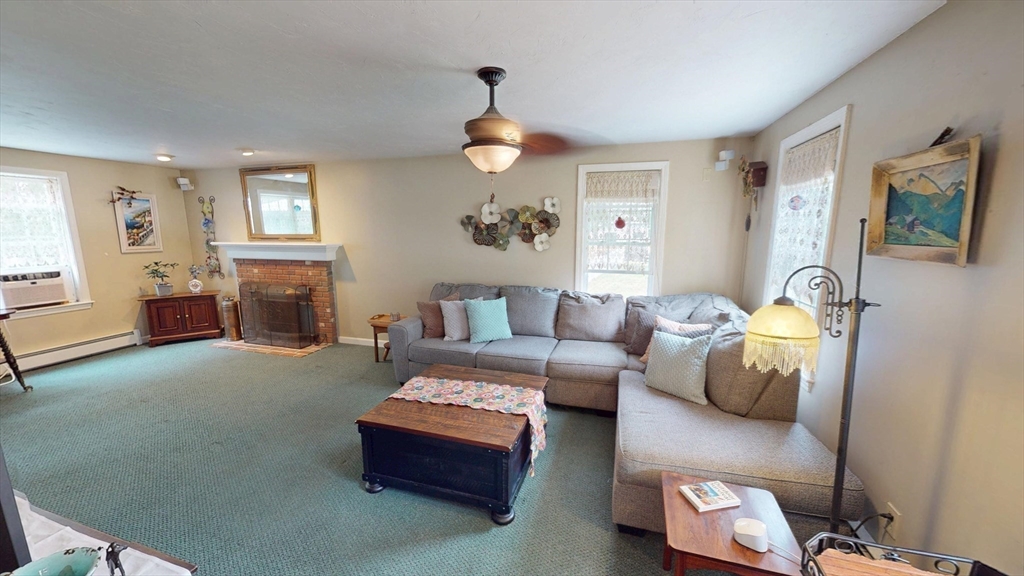 11 Valley View Circle Rutland, MA 01543 - Photo 18 of 38 a living room with furniture and a fireplace
