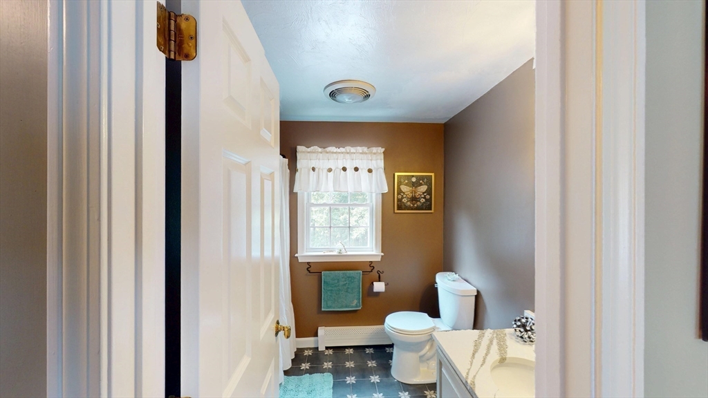 11 Valley View Circle Rutland, MA 01543 - Photo 33 of 38 a bathroom with a toilet sink and mirror