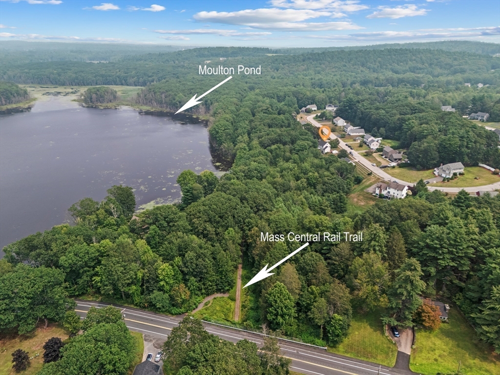 11 Valley View Circle Rutland, MA 01543 - Photo 37 of 38 a view of a lake with a yard and mountain in the background