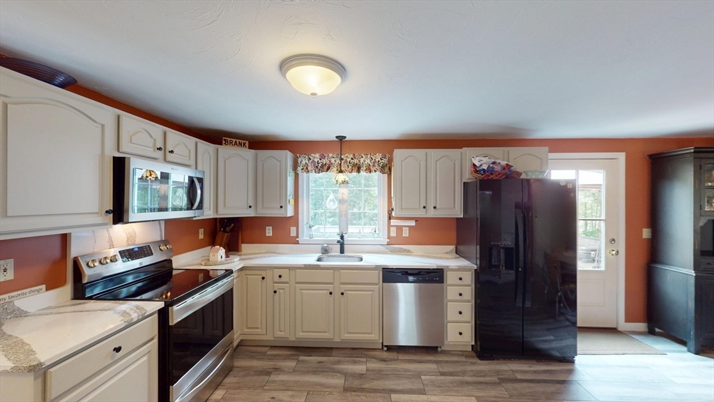 11 Valley View Circle Rutland, MA 01543 - Photo 4 of 38 a kitchen with a sink stove and refrigerator