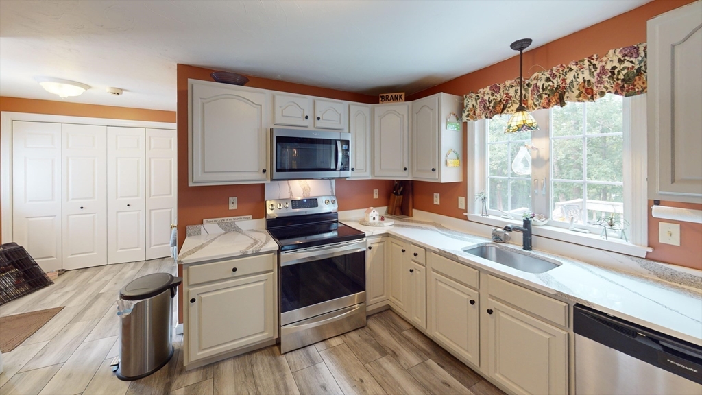 11 Valley View Circle Rutland, MA 01543 - Photo 5 of 38 a kitchen with stainless steel appliances a stove sink and microwave