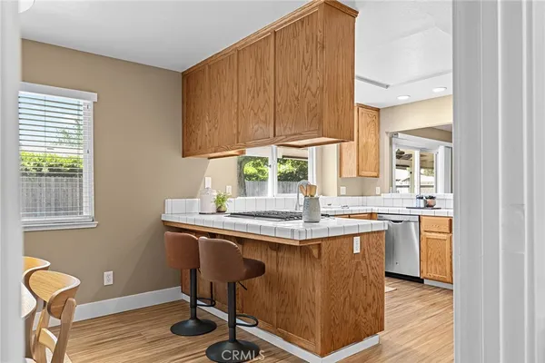 a kitchen with a sink cabinets and window