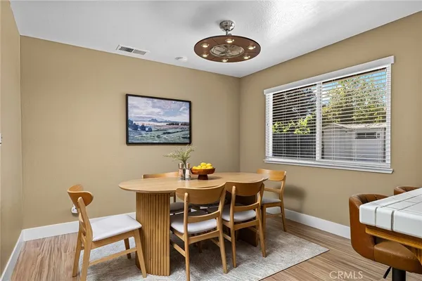 a dining room with furniture and window