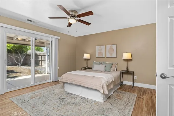 a bedroom with a large bed and a window