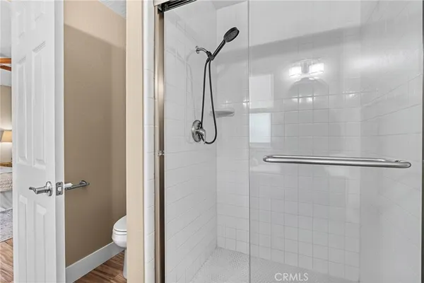 a bathroom with a glass shower door