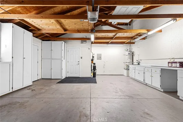 a view of a utility room with wooden walls