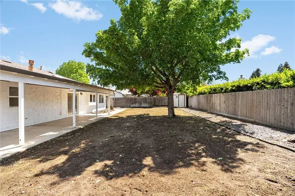 a view of a house with a fence